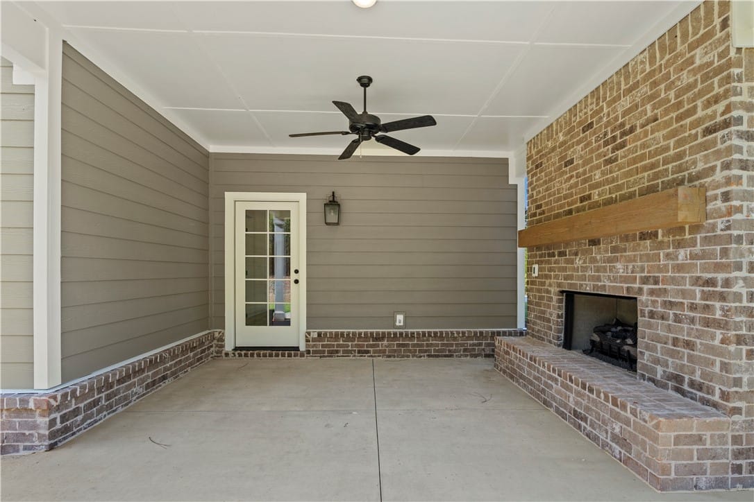 2 Lee Rd 344, Salem, AL 36874, An inviting covered patio featuring a brick firepl