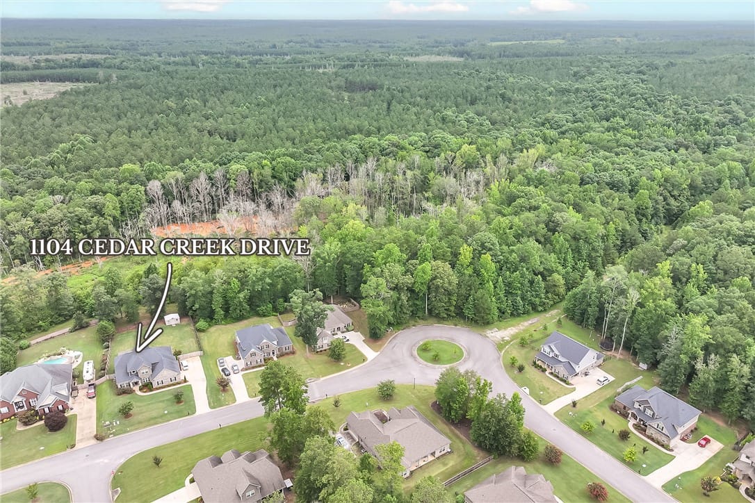 1104 Cedar Creek Dr, Opelika, AL 36801, An aerial perspective showcases a residential neig