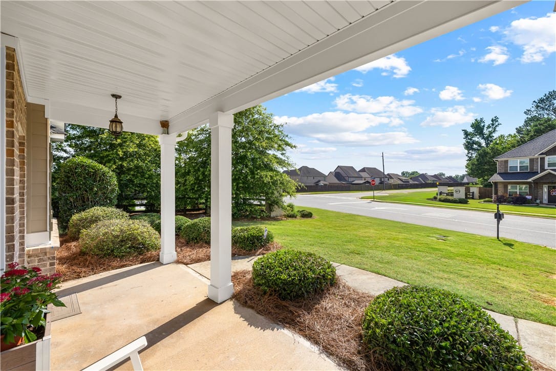 802 W Richland Cir, Auburn, AL 36832, A welcoming front porch, adorned with manicured sh