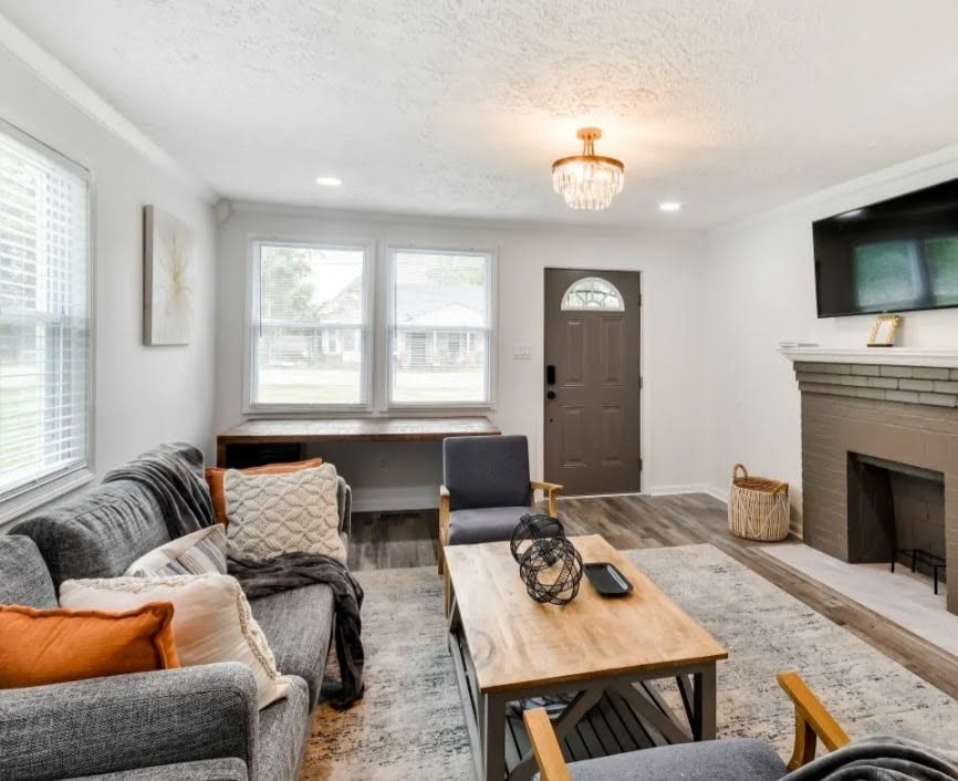 503 Alexander St, Tuskegee, AL 36083, An inviting hearth centers this comfortable living