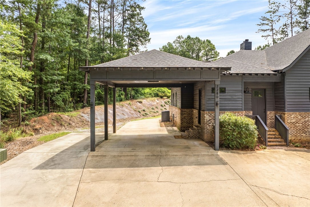 2280 Turtle Creek Court, Opelika, AL 36801, USA, A welcoming carport provides shelter, complementin