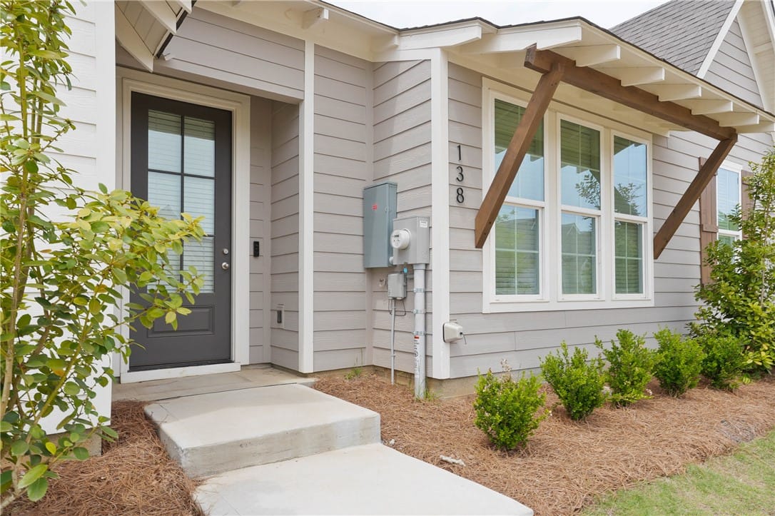 138 Summers Rd, Opelika, AL 36804, This inviting home facade features modern siding a