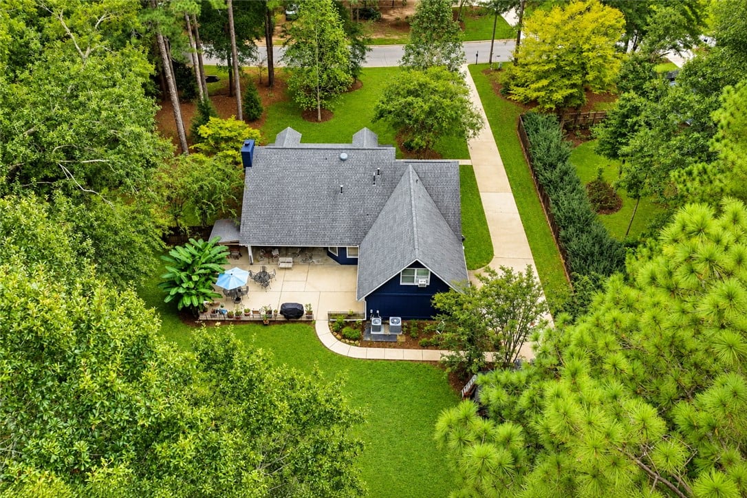2329 Rockdell Ln, Auburn, AL 36830, Mature trees frame a sprawling lawn and patio behi