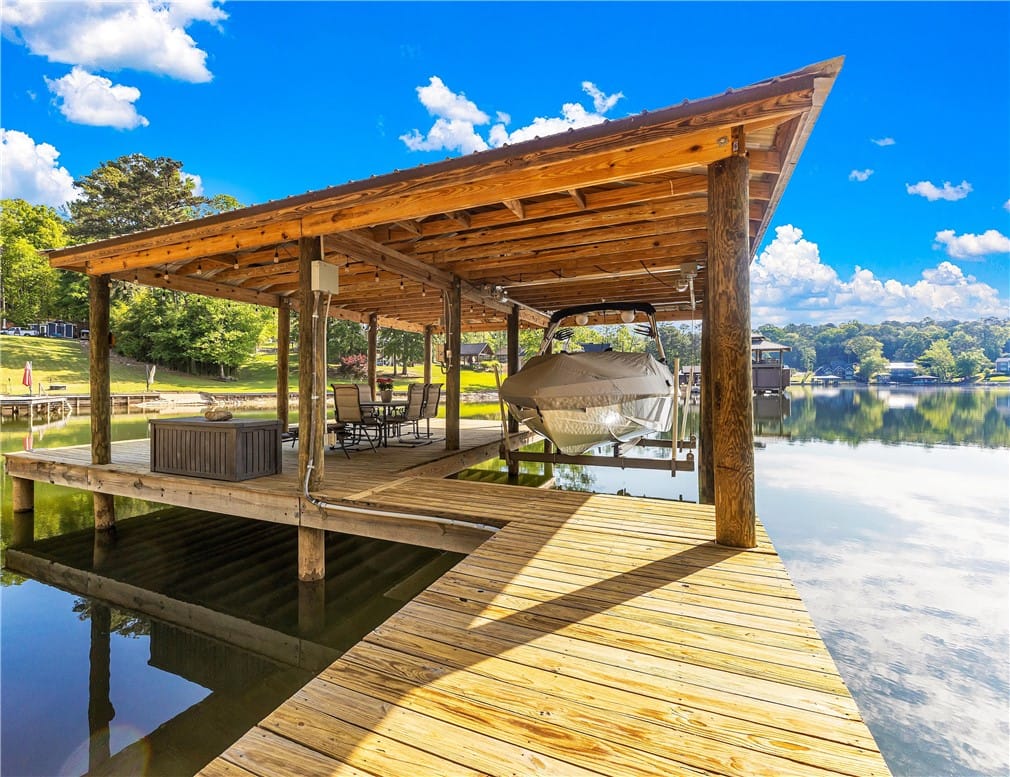 74 Bluebird Rd, Jackson's Gap, AL 36861, This tranquil waterfront dock features a covered b