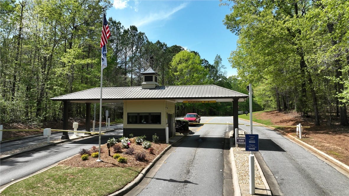 97 S Fern Rdg, Dadeville, AL 36853, A secure gated entry welcomes residents, framed by
