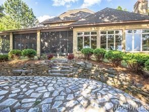 324 Katie Ln, Titus, AL 36080, An inviting stone patio leads to a screened-in por