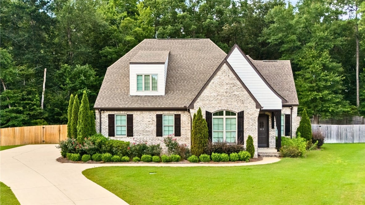 217 Brookshire Ct, Auburn, AL 36832, A graceful residence with a light brick facade and