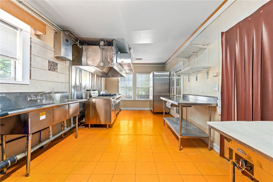 5304 20th Ave, Valley, AL 36854, A vibrant yellow floor complements the professiona