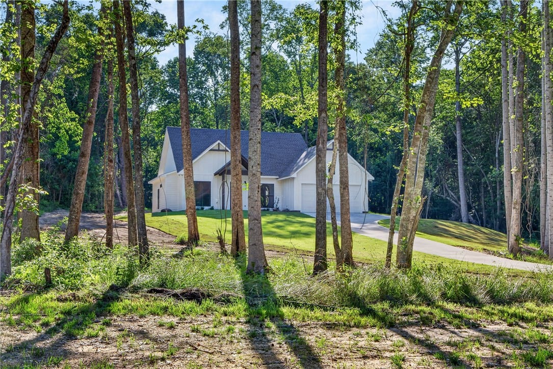 107 LEE ROAD 2058, Salem, AL, 36874, A private wooded setting surrounds this modern res