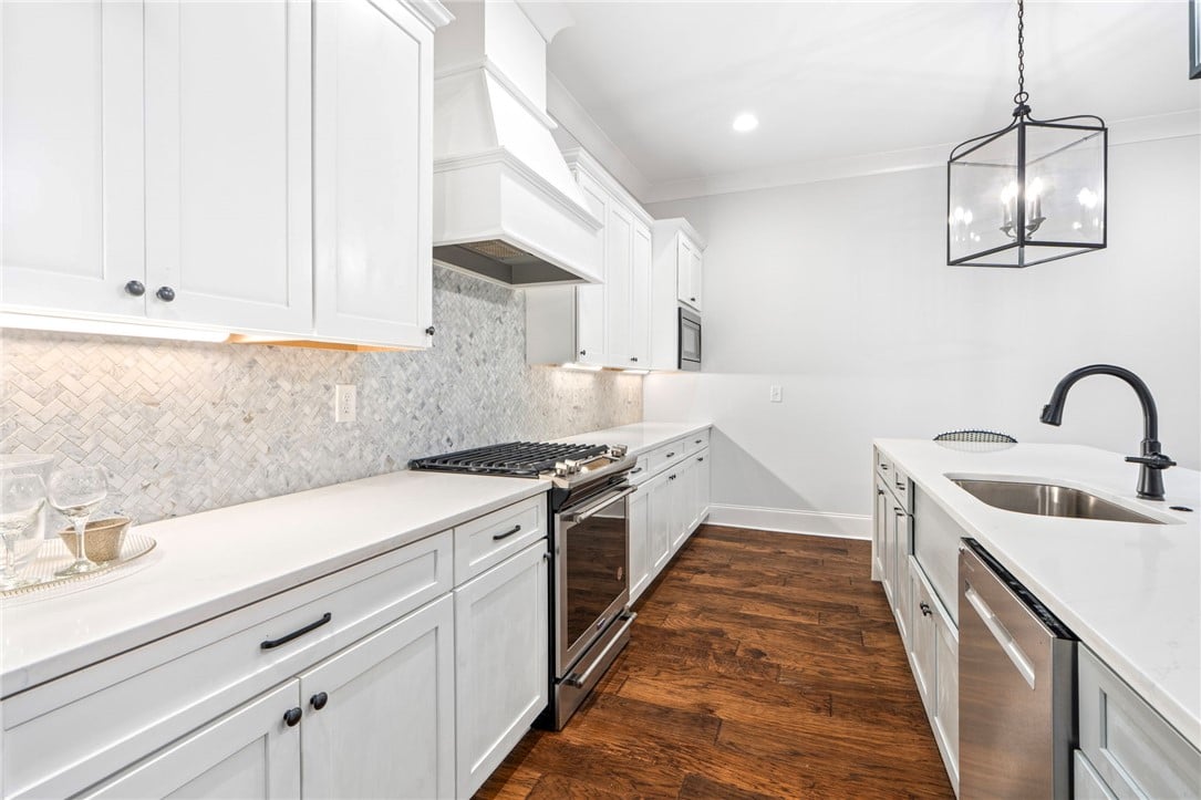 604 Overbrook Ln, Auburn, AL 36830, The kitchen's white cabinetry and countertops are