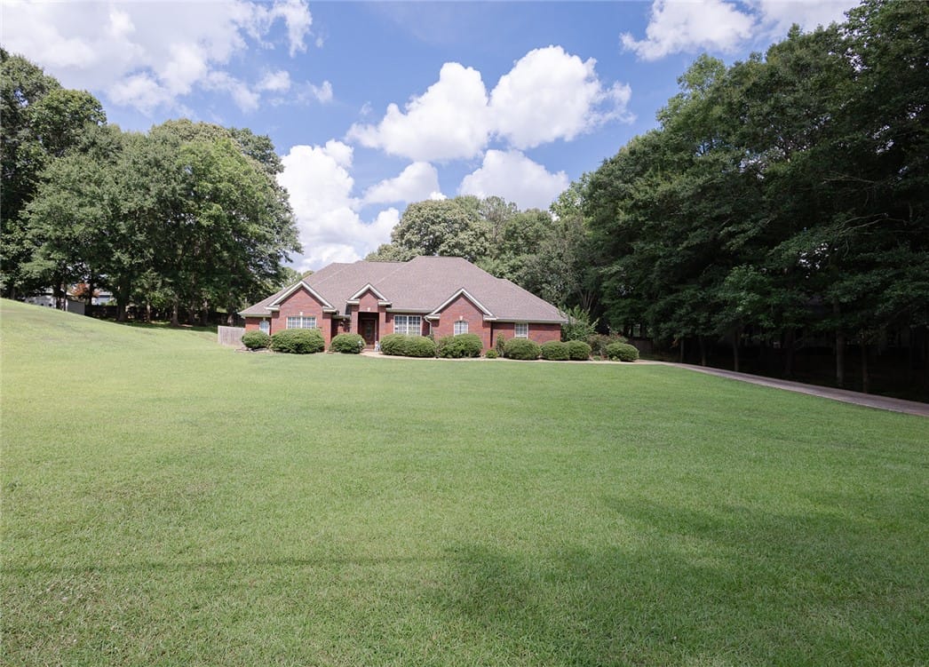 104 N 26th Ave, Lanett, AL 36863, A classic brick residence nestled on an expansive,