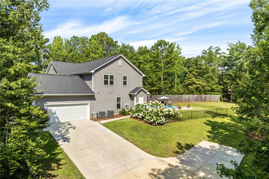 183 Lee Road 735, Opelika, AL 36804, A private backyard oasis features a fenced-in pool