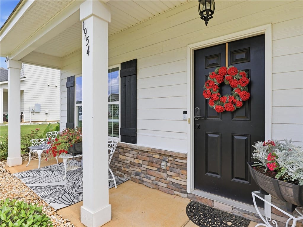 1954 Boxwood Wy, Opelika, AL 36804, A welcoming front porch features a stylish black d