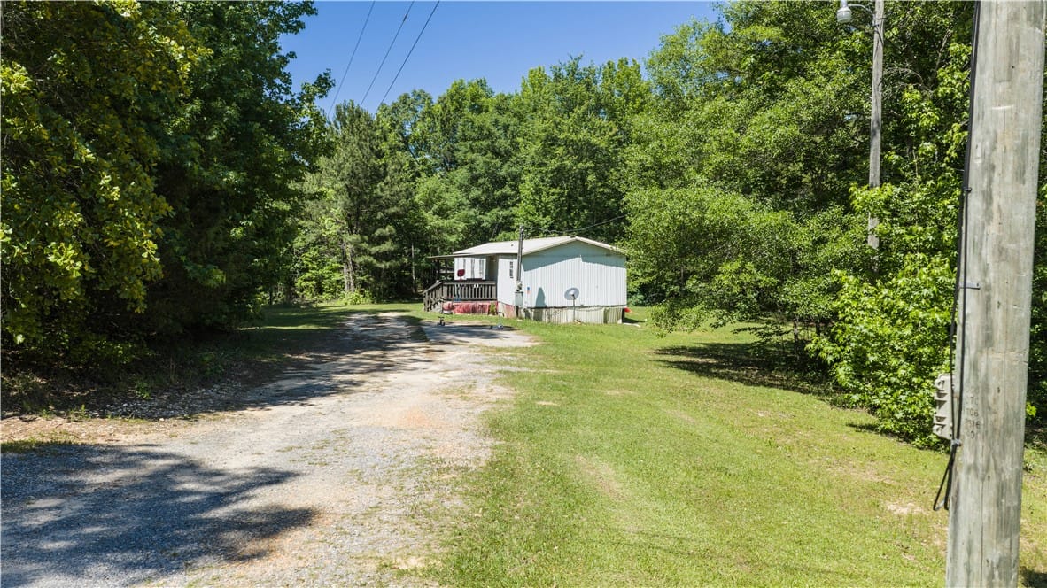 2187 Rock Springs Rd #2187, Jackson's Gap, AL 36861, A private driveway leads to a modest dwelling, nes