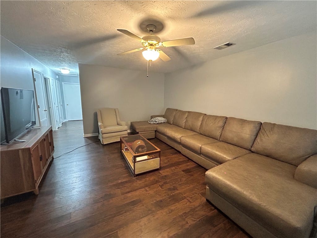 785 Iroquois Cir, Auburn, AL 36830, Hardwood floors and a ceiling fan create a comfort