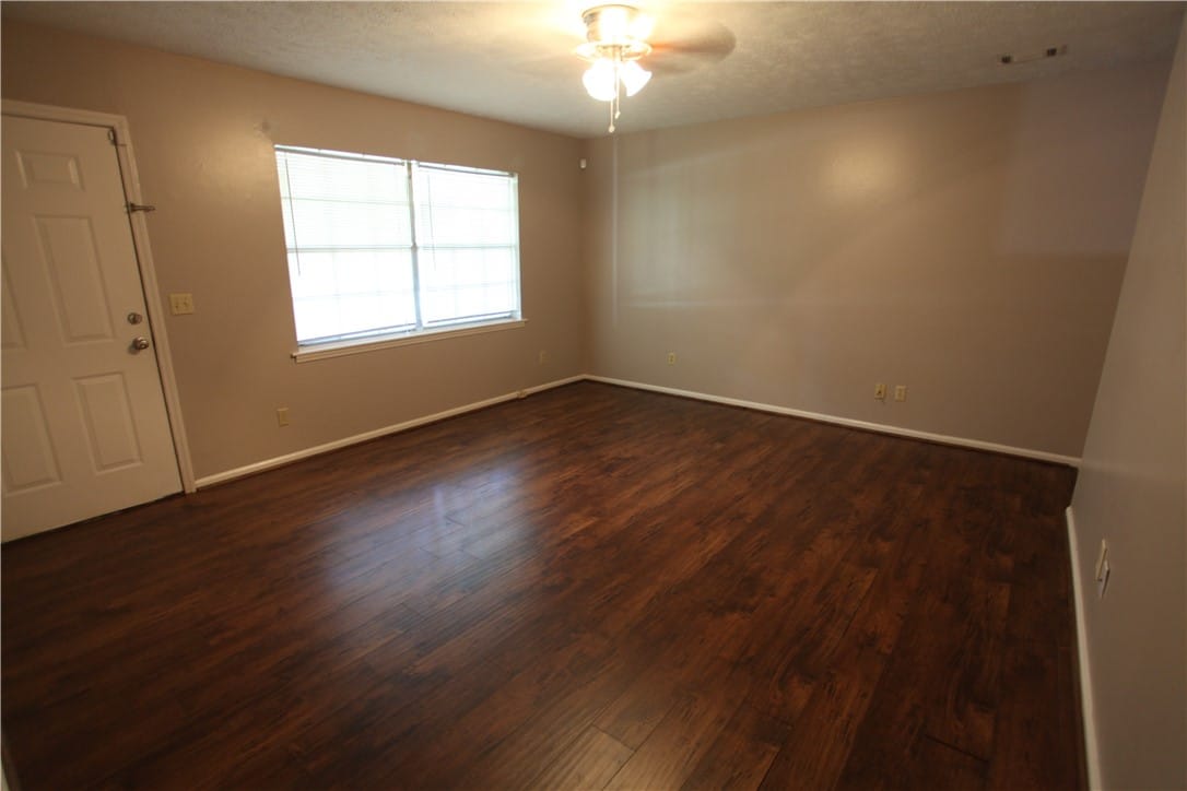 949 Tisdale Cir, Auburn, AL 36830, This inviting room features rich wood flooring and