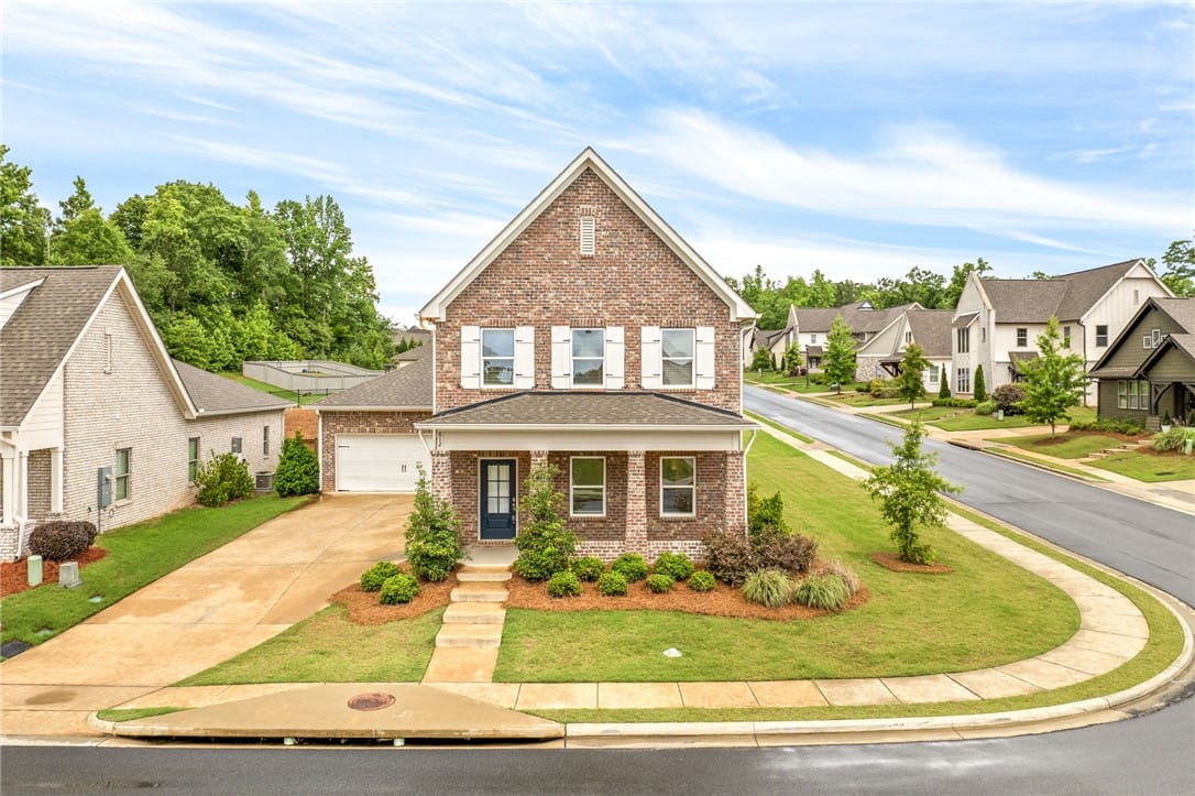 812 Clear Spring Dr, Auburn, AL 36830, A classic brick exterior, complete with a covered