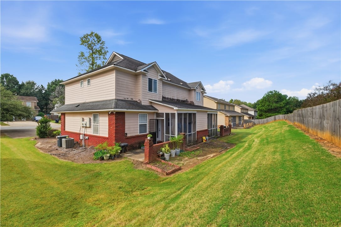 351 Jack Hampton Dr, Auburn, AL 36830, An expansive green lawn borders this multi-level h