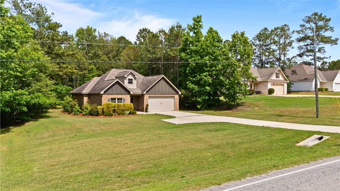 14361 AL-51, Opelika, AL 36804, USA, This charming home features a well-manicured lawn
