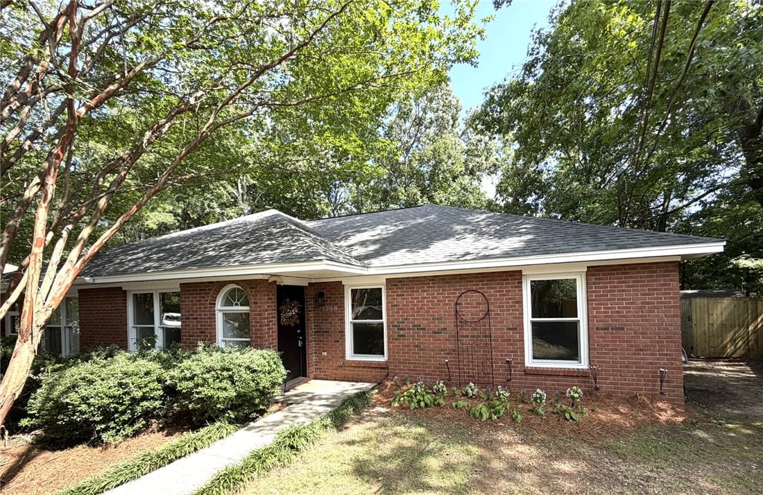 1398 Kurt Cir, Auburn, AL 36830, A well-kept brick residence presents a welcoming f