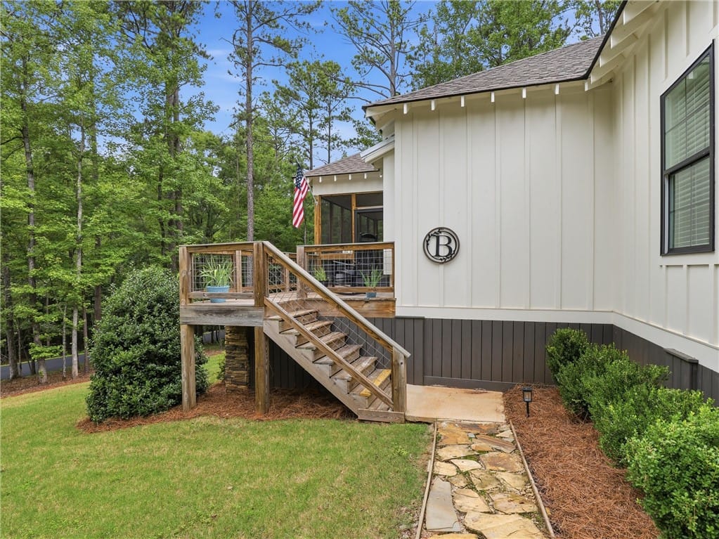 18 Hart Ln, Dadeville, AL 36853, A stone pathway leads to a wooden deck, perfectly