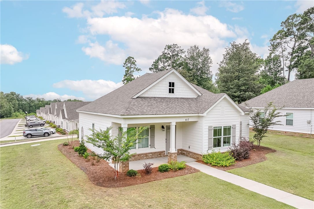 417 Morris Ave, Opelika, AL 36801, Welcoming covered porch, a well-kept lawn, with su