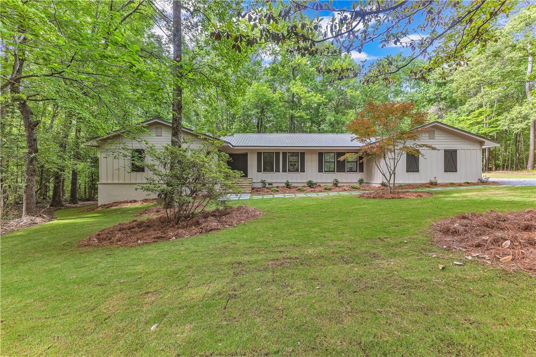 1796 Magnolia St, Alexander City, AL 35010, A private, nature-immersed dwelling nestled amidst
