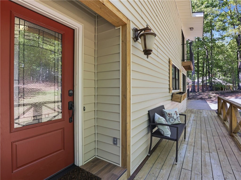 80 Stillwaters Grove, Dadeville, AL 36853, This inviting entrance features a warm wooden porc