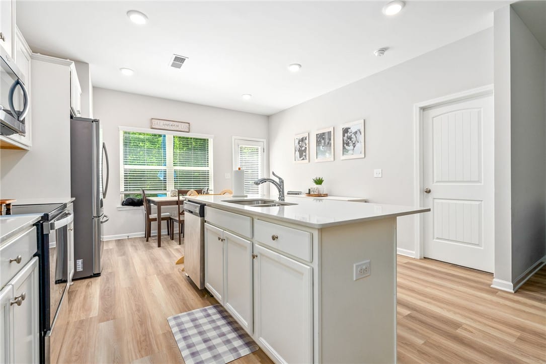 865 Lismore Dr, Opelika, AL 36804, A contemporary kitchen boasts a spacious island wi