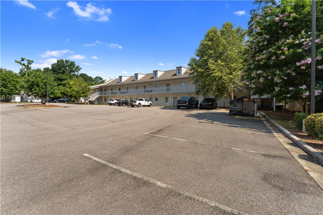 149 S Debardeleben St #103, Auburn, AL 36830, Ample asphalt parking accommodates residents of th