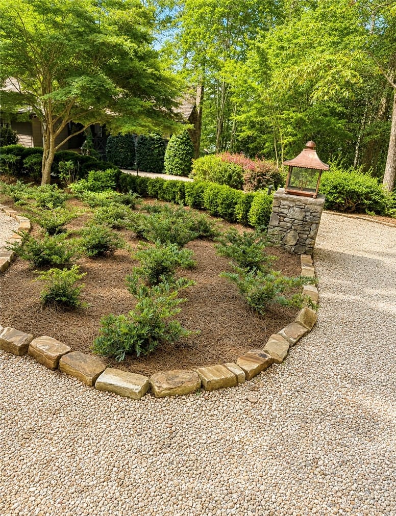 390 Neros Point, Eclectic, AL 36024, USA, A gracefully curved stone border delineates a verd
