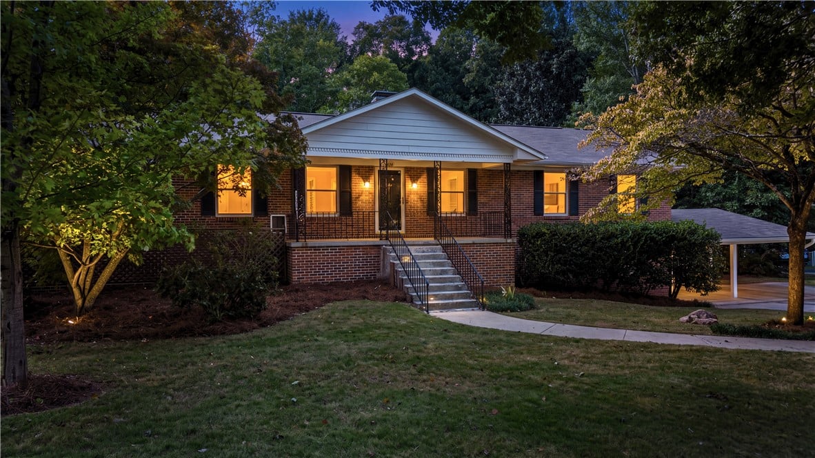 426 Sehoy Cir, Auburn, AL 36830, An inviting brick elevation framed by mature trees