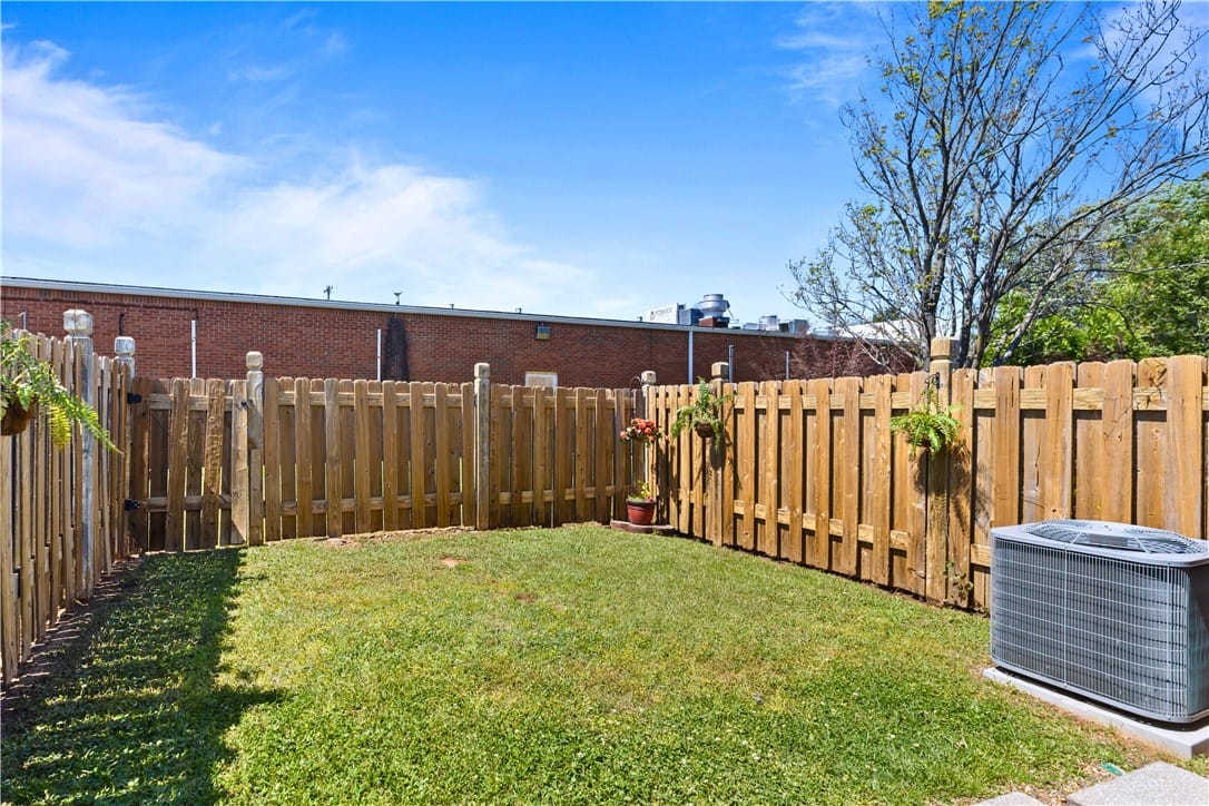 2003 Executive Park Dr #108, Opelika, AL 36801, A well-kept yard enclosed by a robust wooden fence
