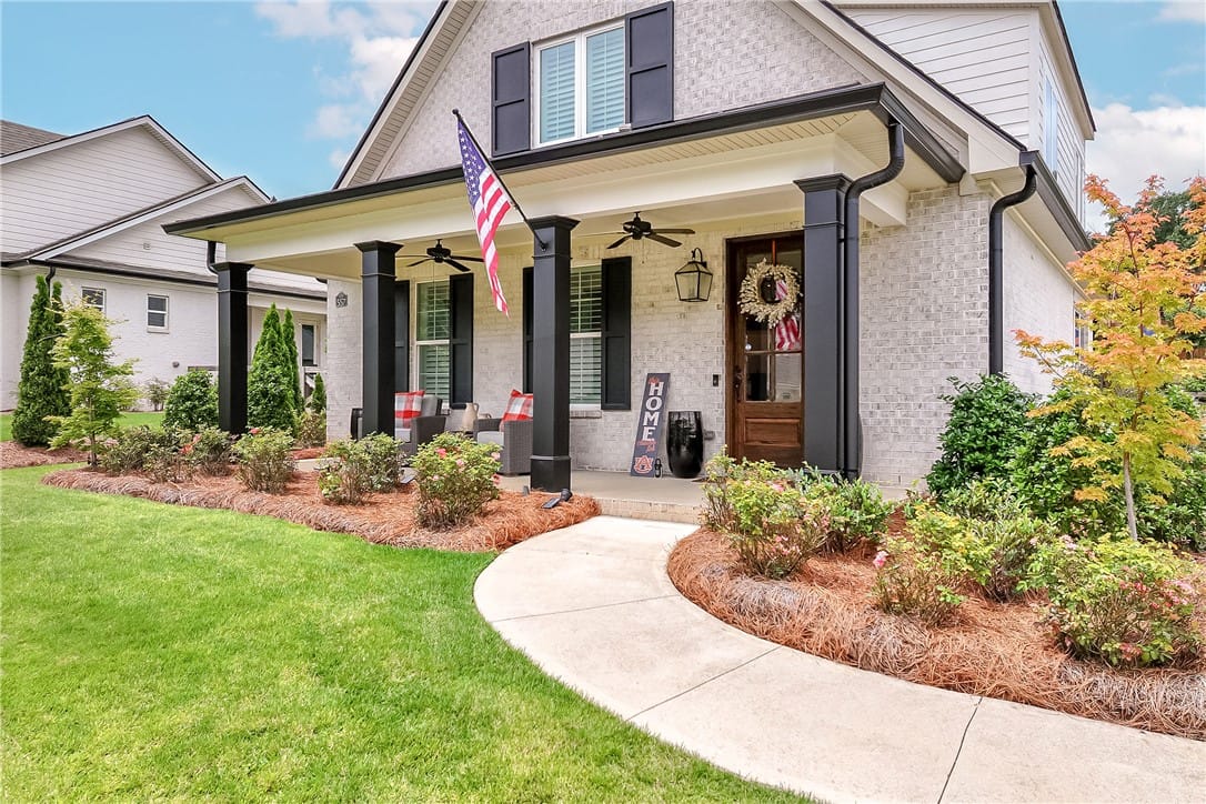 557 Arbor Dr, Auburn, AL 36830, A graceful sidewalk curves toward a welcoming porc