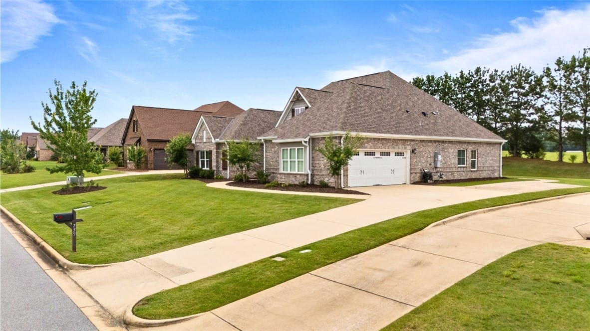 739 E Towne Lake Pkwy, Opelika, AL 36804, A graceful brick home featuring an attached garage